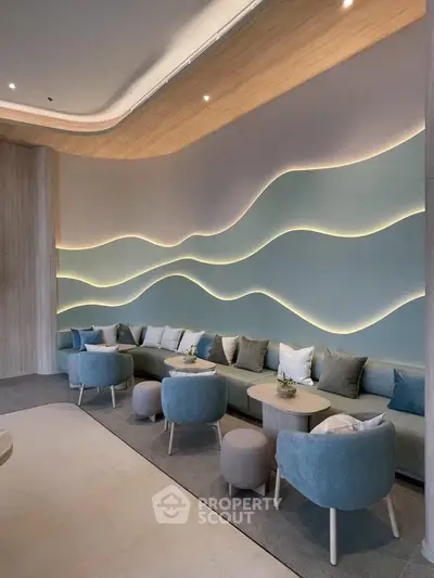 Luxurious modern lounge with stylish wave wall design and plush seating, perfect for relaxation and social gatherings.
