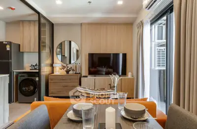 Modern living room with stylish decor, open layout, and balcony access in a contemporary apartment.