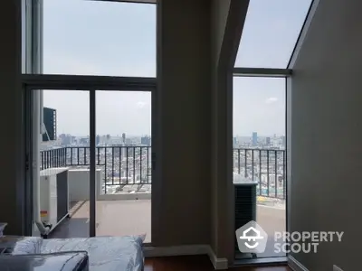 Stunning high-rise apartment with expansive city views and private balcony.