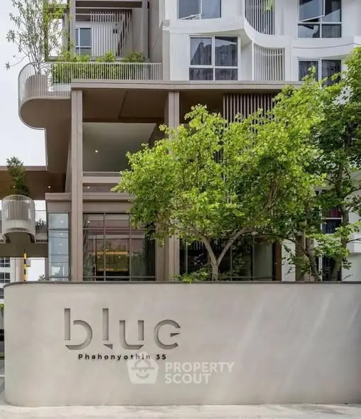 Modern architectural building with lush greenery at Blue Phahonyothin 35