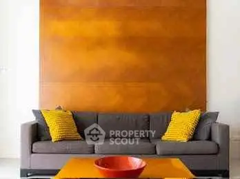 Modern living room with stylish sofa and vibrant decor accents