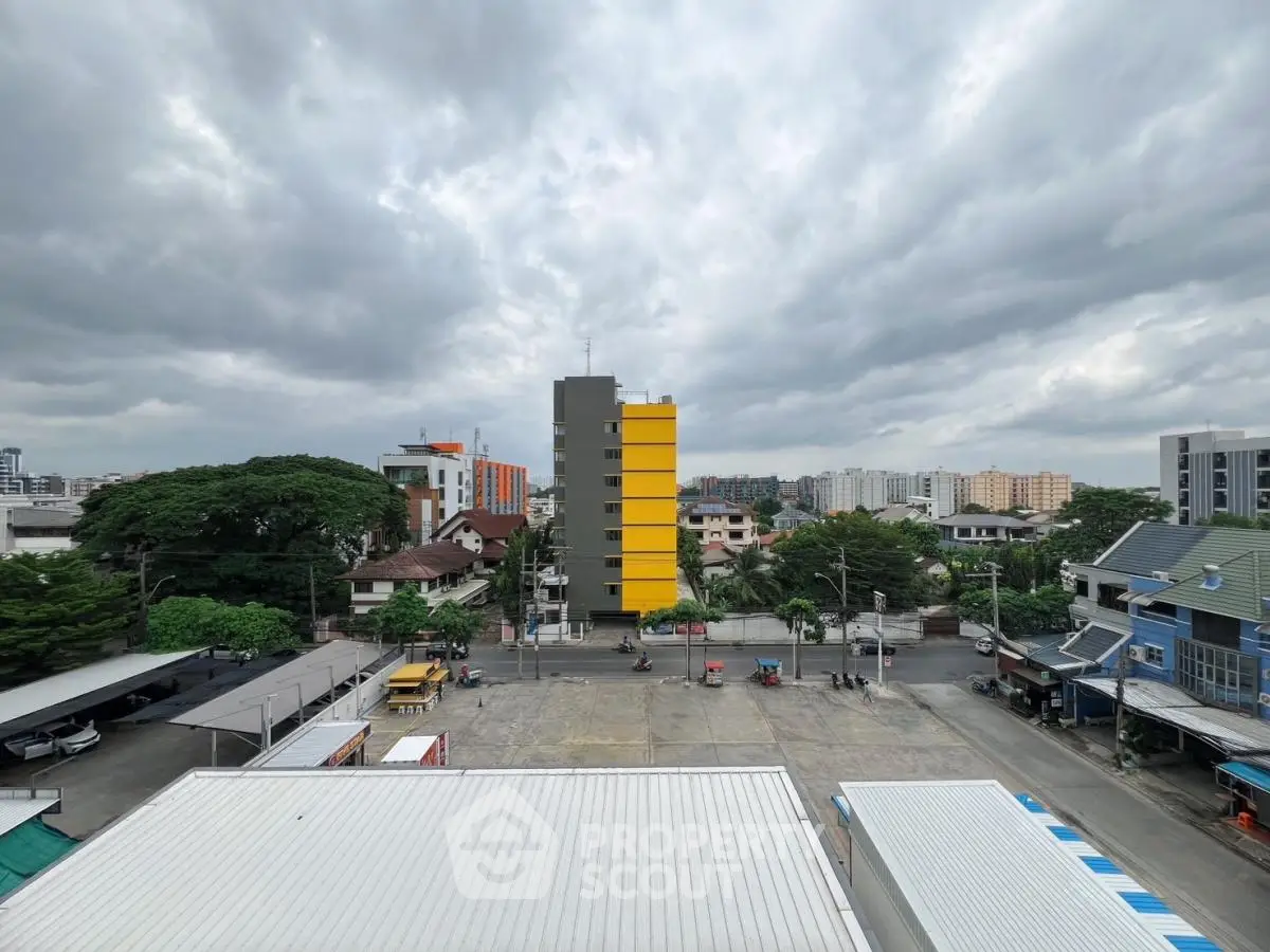 Panoramic urban view with residential buildings and cloudy sky