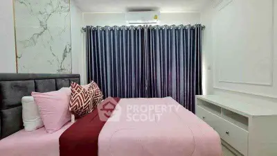 Cozy bedroom with modern decor and plush bedding