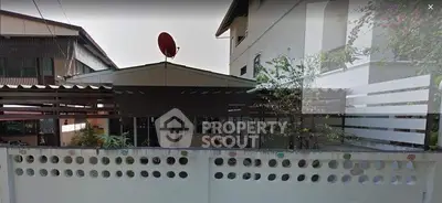 Charming residential property with unique architectural design and satellite dish, perfect for modern living.