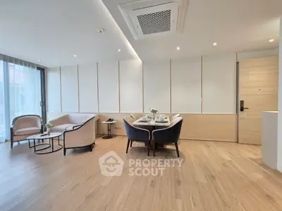 Modern living room with elegant furniture and wooden flooring
