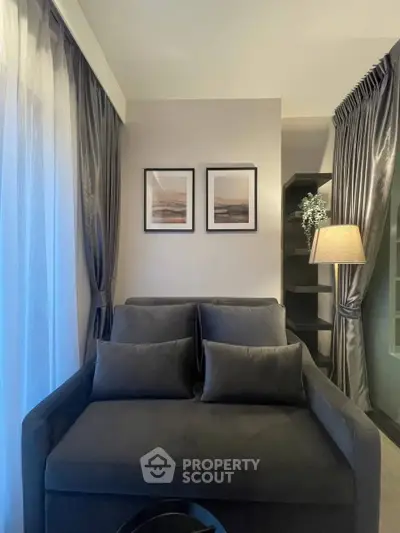 Elegant living room with plush gray sofa and stylish decor