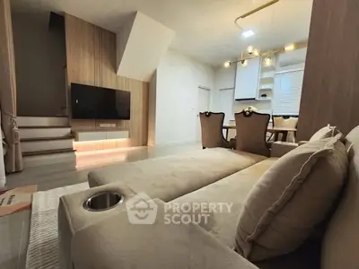 Modern living room with stylish furniture and ambient lighting