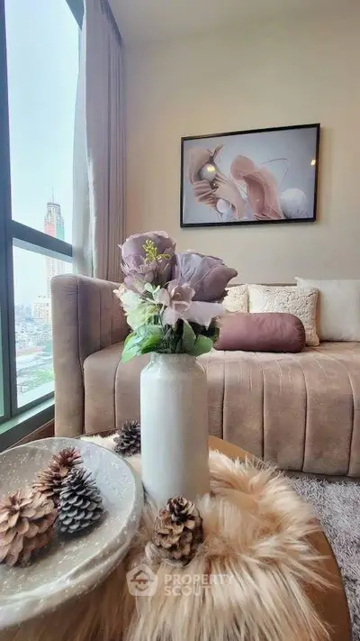 Chic living room with plush sofa, elegant decor, and city view, perfect for modern urban living.