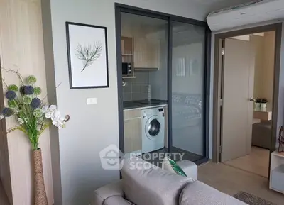 Modern apartment interior with washing machine and stylish decor