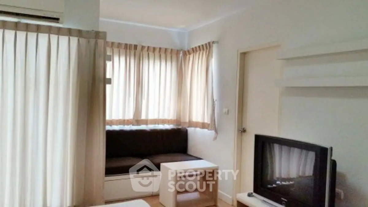 Cozy living room with natural light and modern furnishings