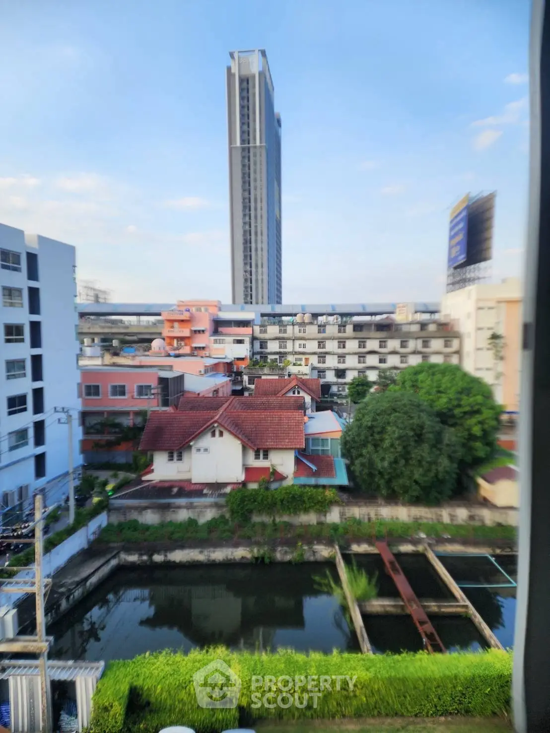 Stunning cityscape view with modern high-rise and charming residential area