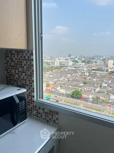High-rise kitchen with stunning city view and modern appliances