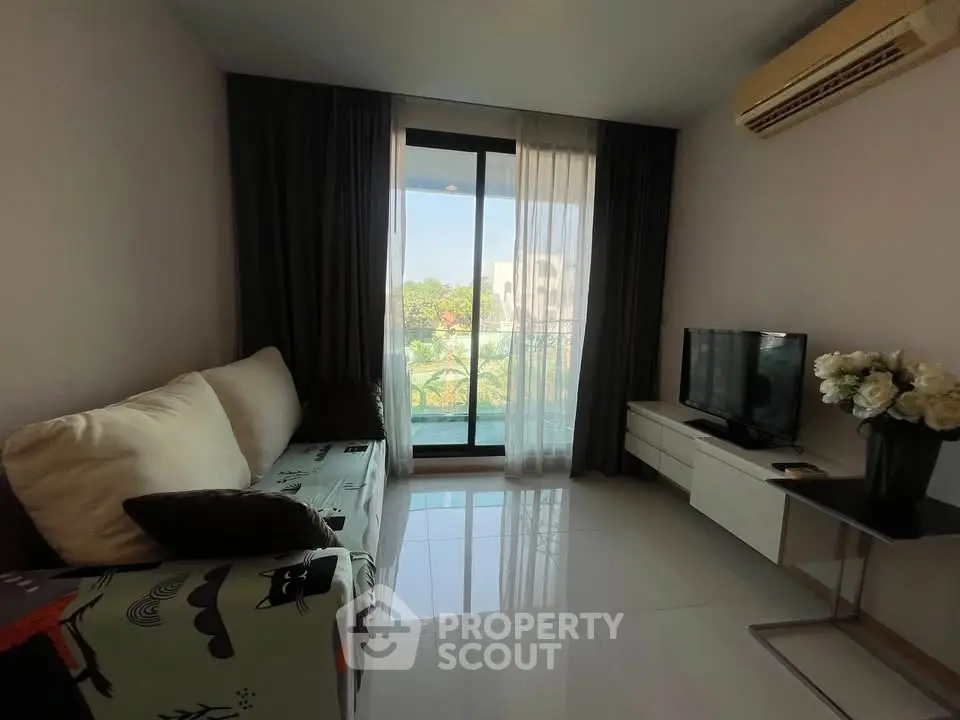 Cozy living room with modern decor and balcony view