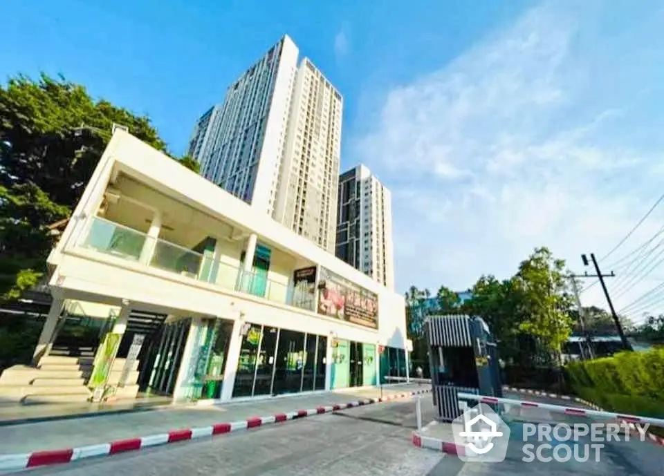 Modern residential building with lush greenery and clear blue sky