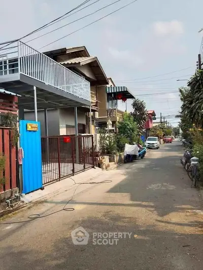 Charming residential street with modern homes and lush greenery, perfect for serene living.