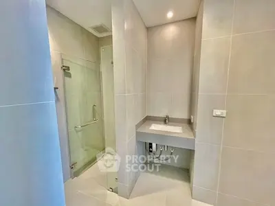 Modern bathroom with sleek design and glass shower enclosure