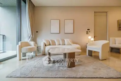 Luxurious modern living room with elegant furniture and large windows