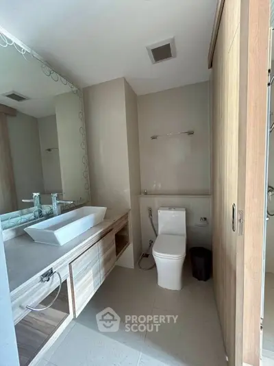 Modern bathroom with stylish vanity and elegant fixtures in a contemporary home.