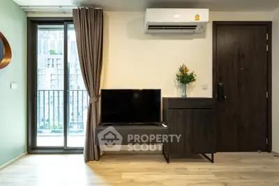 Modern living room with balcony view and sleek furniture