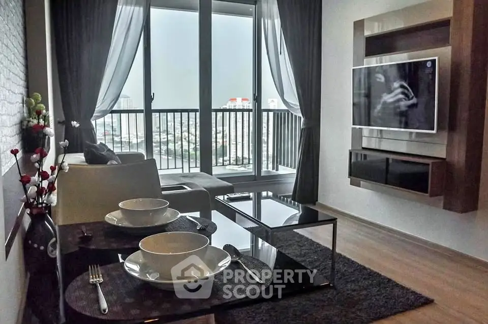 Modern living room with city view, stylish decor, and large windows for natural light.