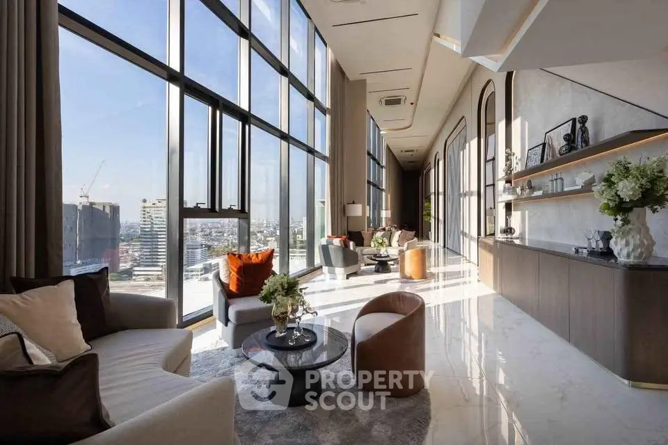 Luxurious high-rise living room with panoramic city views and elegant modern decor.
