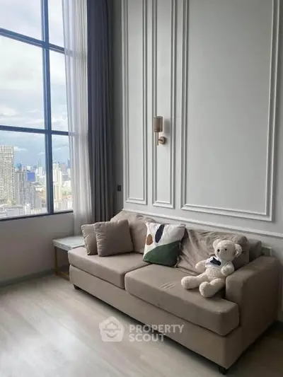 Stylish living room with plush sofa and city view from large window