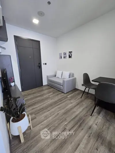 Modern living room with sleek furniture and stylish decor in a contemporary apartment.