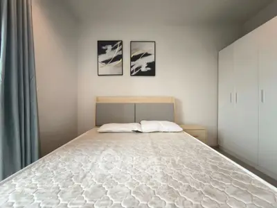 Modern bedroom with stylish decor and ample storage space