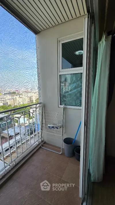 Charming balcony with city view, perfect for relaxation and enjoying urban scenery.