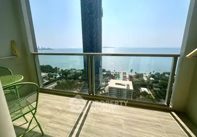 Stunning balcony with panoramic ocean view in high-rise apartment