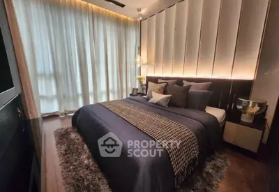 Luxurious bedroom with elegant decor and ambient lighting, featuring a plush bed and stylish curtains.