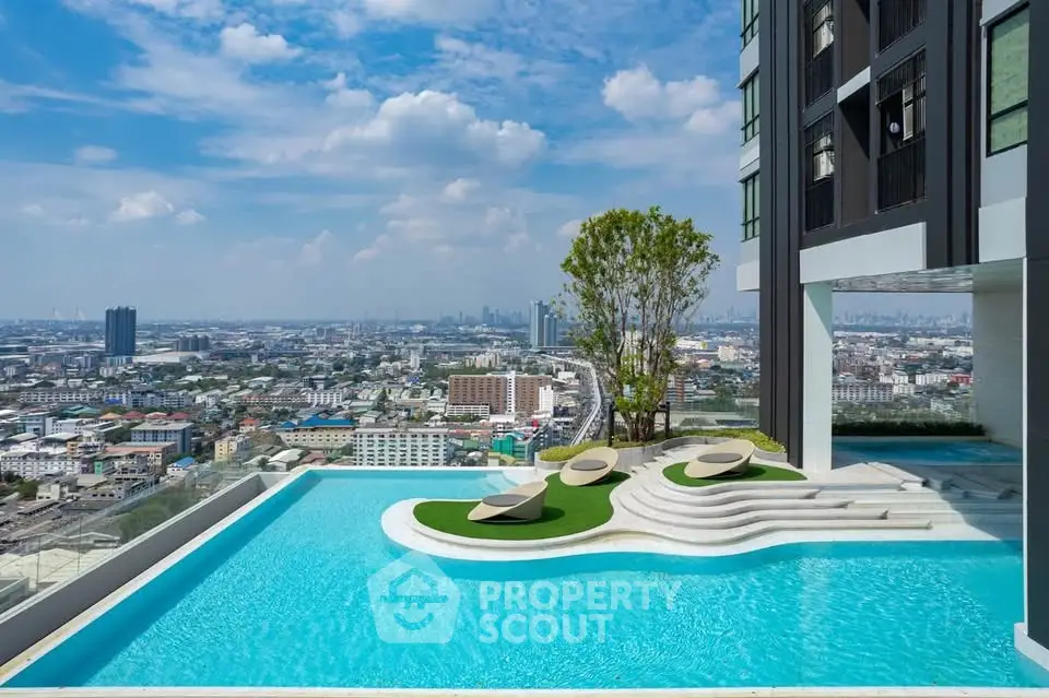 Luxurious rooftop pool with stunning city skyline view in modern high-rise building.