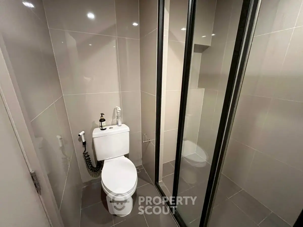 Modern bathroom with sleek glass shower and stylish fixtures