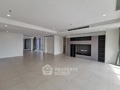 Spacious modern living room with open layout and large windows