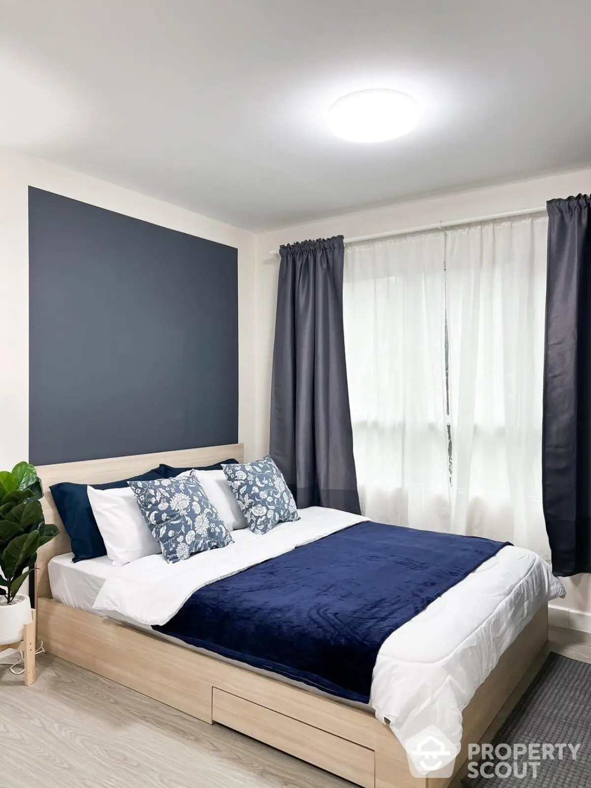 Modern bedroom with stylish decor and natural light