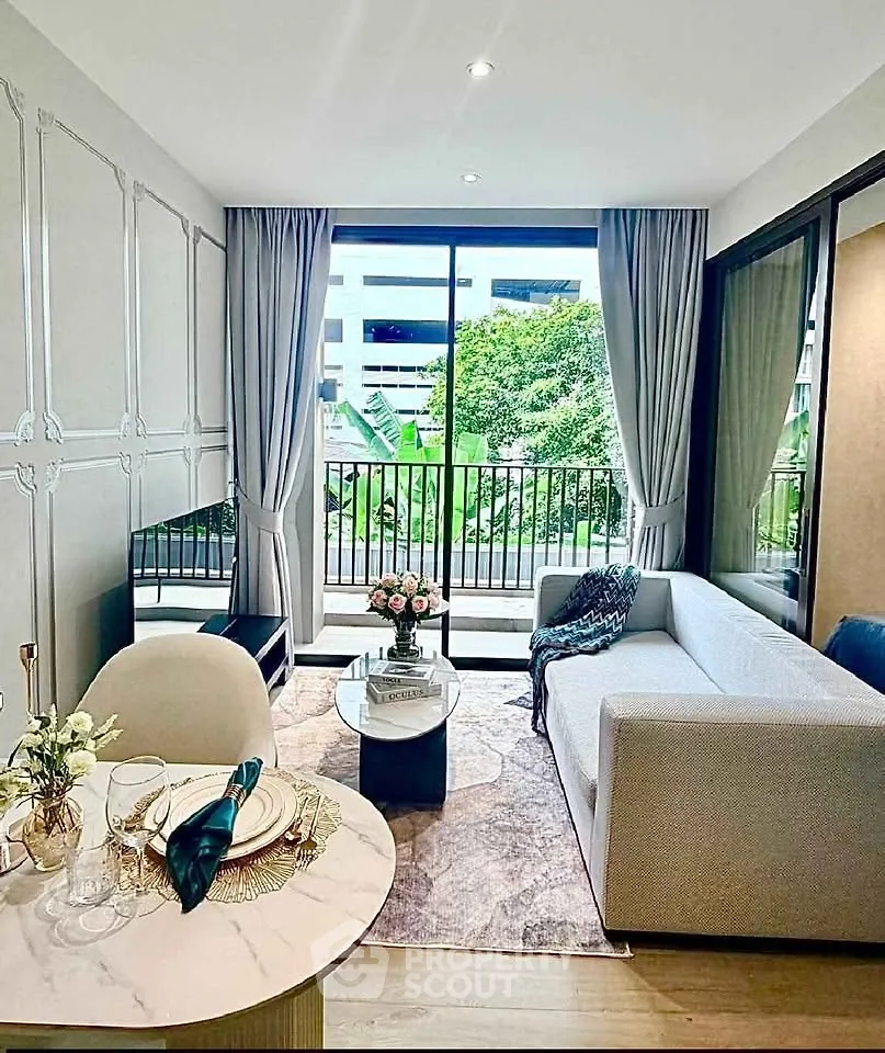 Modern living room with elegant decor and large window overlooking greenery, perfect for urban living.