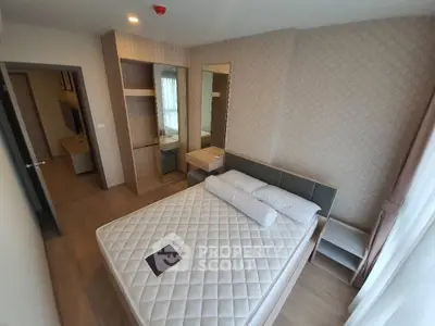 Modern bedroom with stylish decor and ample natural light, featuring a comfortable bed and built-in wardrobe.