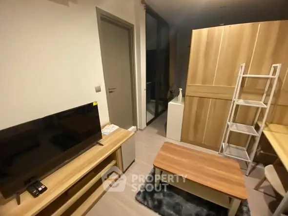 Cozy living room with modern TV setup and stylish wooden furniture