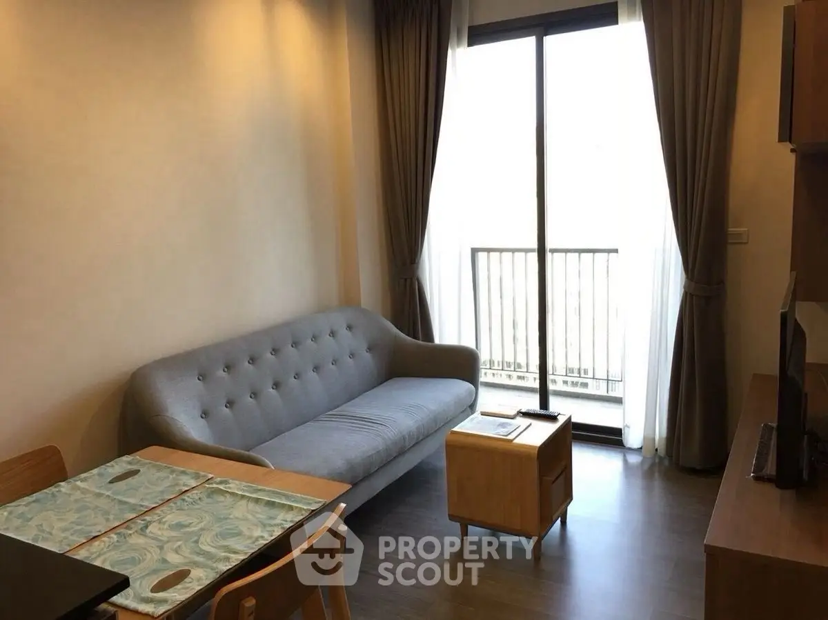 Cozy living room with modern sofa and balcony view