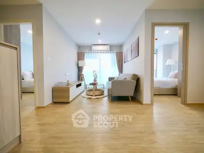 Spacious modern living room with wooden flooring and elegant decor