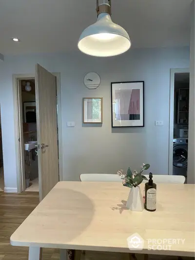 Modern dining area with minimalist decor and natural light