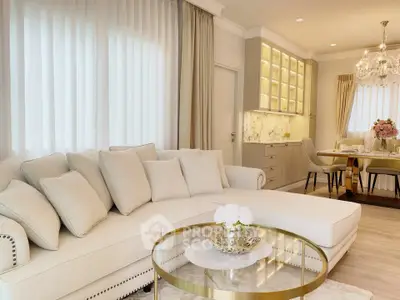 Luxurious living room with elegant dining area and chandelier