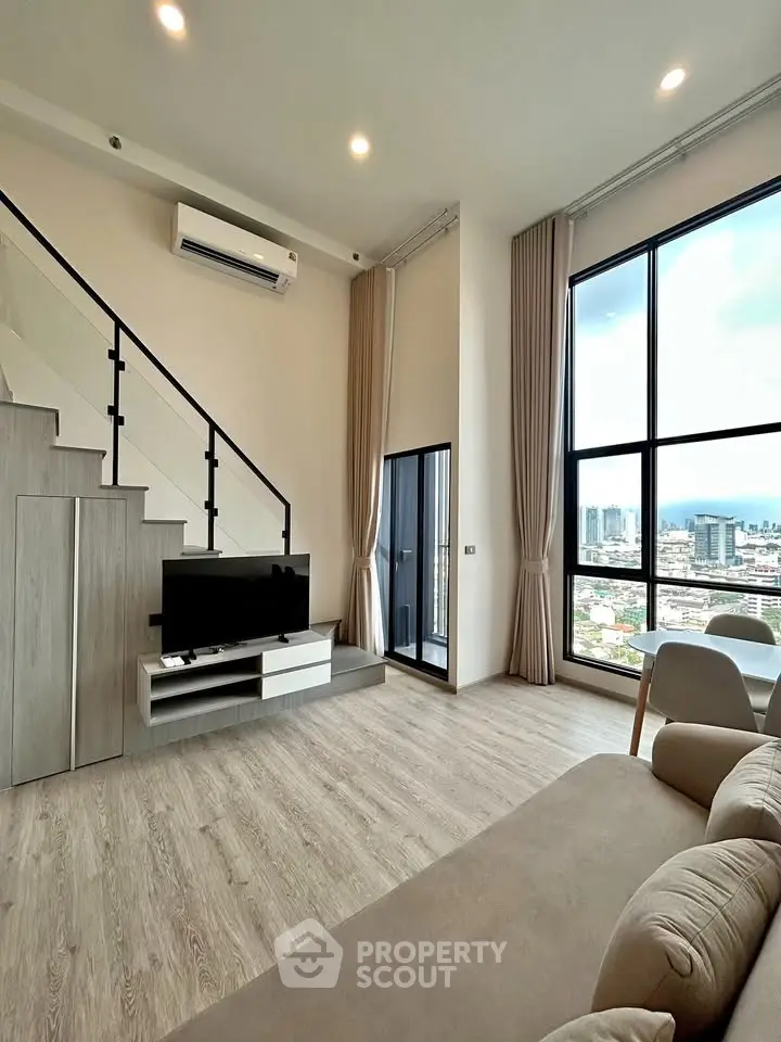 Modern loft apartment with high ceilings and panoramic city views