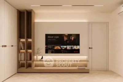 Modern living room with built-in wooden shelves and wall-mounted TV, showcasing minimalist design.