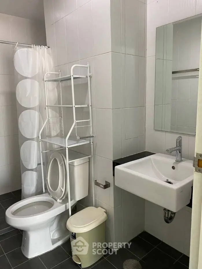 Modern bathroom with sleek fixtures and white tile design