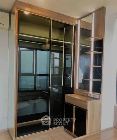 Modern interior with sleek mirrored wardrobe and stylish shelving unit