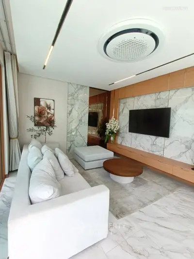 Luxurious modern living room with marble accents and elegant decor