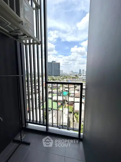 Stunning city view from a modern high-rise balcony, perfect for urban living.