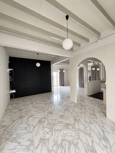 Spacious modern living room with marble flooring and elegant lighting