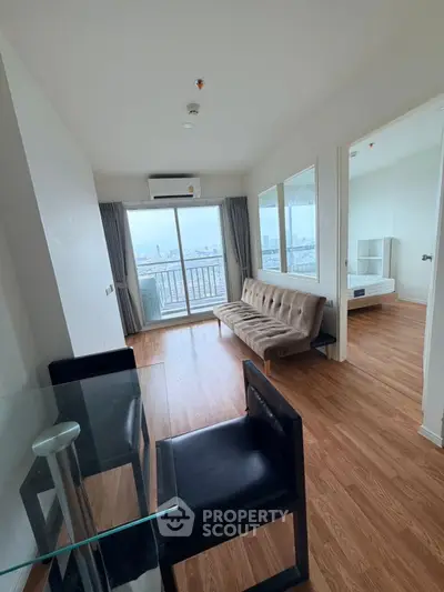 Modern apartment with wooden flooring and city view balcony